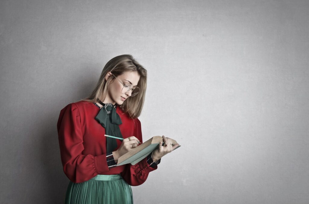 smart adult female student reading book in studio 3772620 1